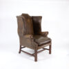 Dark Muddy Green Leather Wing Chair in the Georgian Style, English Circa 1890.