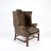 Dark Muddy Green Leather Wing Chair in the Georgian Style, English Circa 1890.