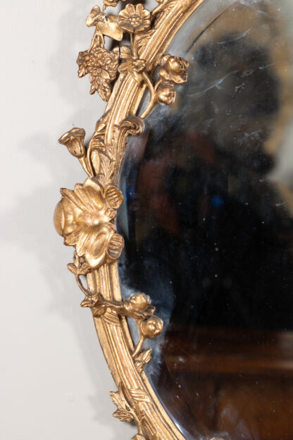 Carved French Giltwood Oval Mirror with Urn Crest and Floral Garlands, Circa 1870