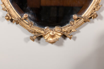 Carved French Giltwood Oval Mirror with Urn Crest and Floral Garlands, Circa 1870