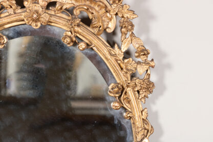 Carved French Giltwood Oval Mirror with Urn Crest and Floral Garlands, Circa 1870