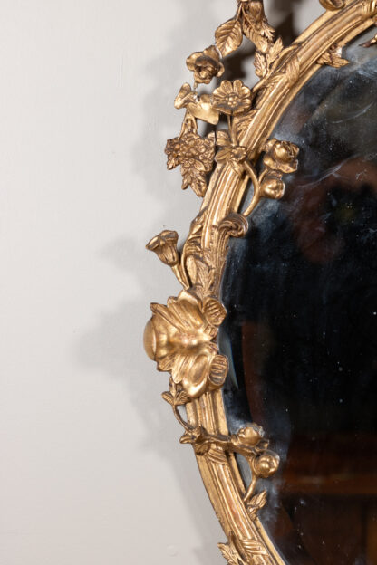 Carved French Giltwood Oval Mirror with Urn Crest and Floral Garlands, Circa 1870